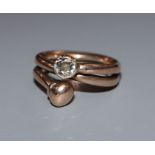 An early 20th century old mine cut diamond set twin open shank dress ring, size O.