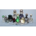 Fourteen assorted late 19th/early 20th century silver or white metal mounted glass small scent