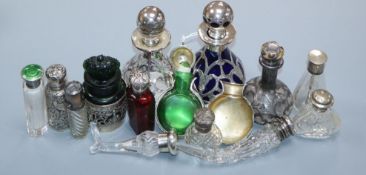 Fourteen assorted late 19th/early 20th century silver or white metal mounted glass small scent