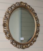 A 19th century oval Florentine gilt wall mirror H.66cm