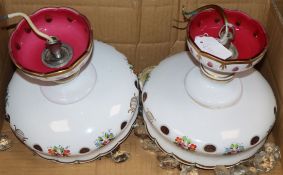 A pair of Victorian cranberry glass overlaid lustre lights