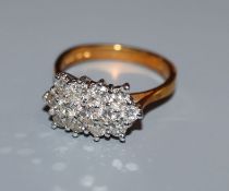 A modern 18ct gold and diamond cluster ring, size M.