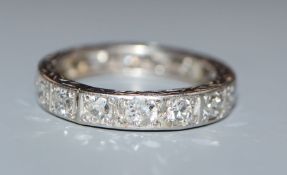 A white metal and diamond set full eternity ring, size alteration, size K/L.