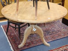 A pine circular breakfast table on pillar and tripod base W.120cm