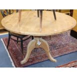 A pine circular breakfast table on pillar and tripod base W.120cm