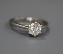 A modern platinum and solitaire diamond ring, the stone weighing approximately 0.66cts, size I.