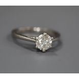 A modern platinum and solitaire diamond ring, the stone weighing approximately 0.66cts, size I.