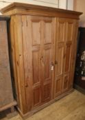 A panelled pine two door home office cabinet W.129cm