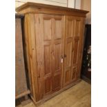 A panelled pine two door home office cabinet W.129cm