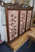 A large 19th century Javanese teak screen with Batik panels by Pamang 59cm