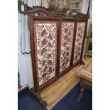 A large 19th century Javanese teak screen with Batik panels by Pamang 59cm