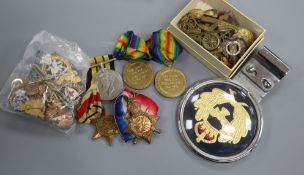 A group of medals, Military car badge, cap badges etc