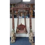 An impressive Indian carved polychrome wood swing, Jaipur W.approx. 140cm, H.approx. 247cm