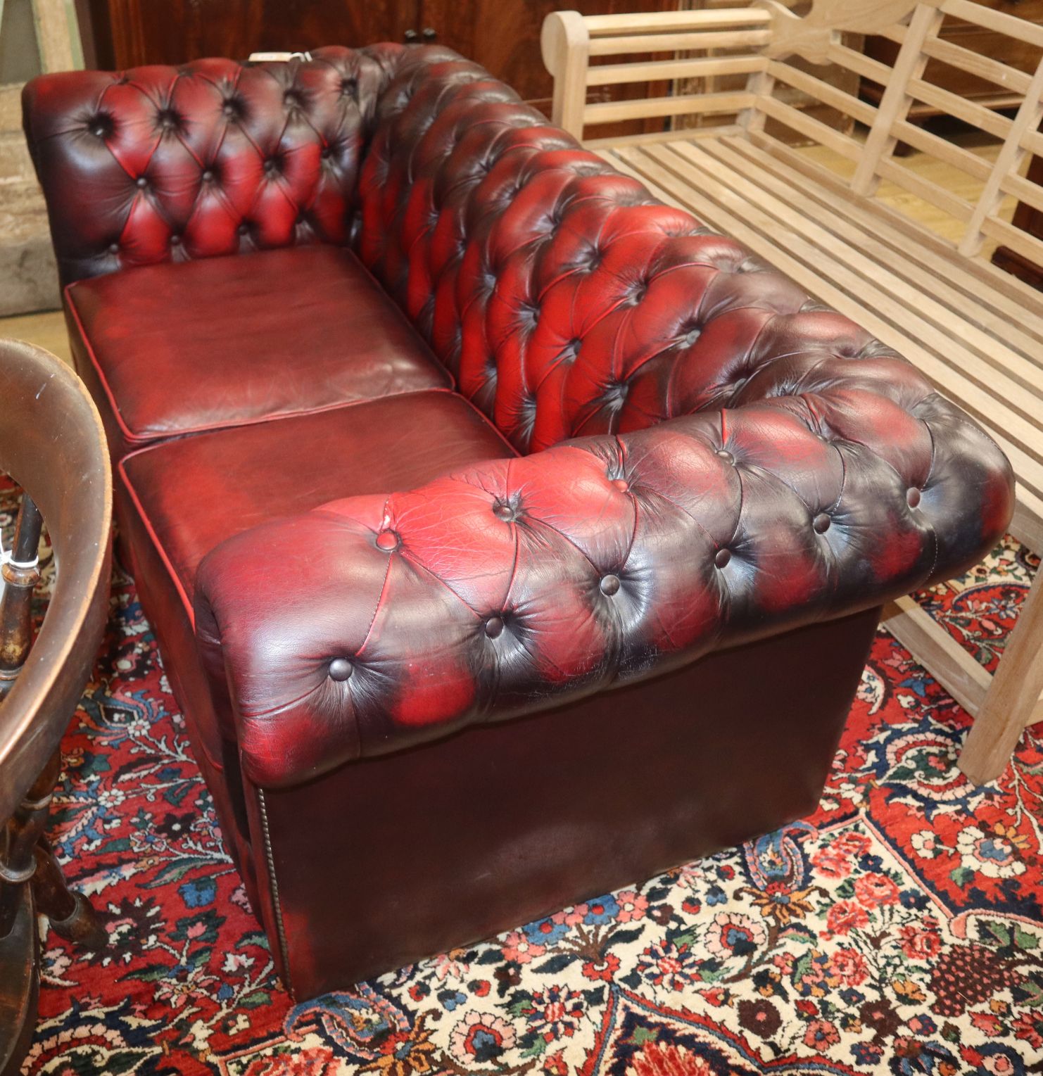 A leather button back chesterfield W.160cm