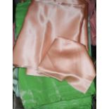 A 1930s length of lime green silk, another length of crepe de shine peach satin, etc