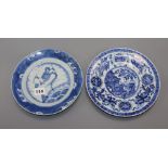 An 18th century Kangxi Chinese blue and white dragon plate and one other. largest diameter 22.5cm