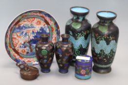 Five cloisonne vases, a cloisonne canister, a Chinese bronze pouring vessel and Imari dish tallest