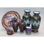 Five cloisonne vases, a cloisonne canister, a Chinese bronze pouring vessel and Imari dish tallest