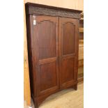 An Indonesian teak two-door cupboard W.124cm