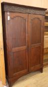 An Indonesian teak two-door cupboard W.124cm