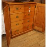 A pine cupboard with fitted campaign handle drawers W.92cm