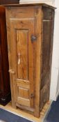 A French 19th century pine narrow hanging cupboard with panelled door H.170cm