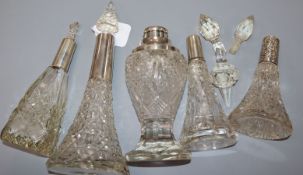 Five assorted early 20th century silver mounted cut glass scent bottles, three of conical form,