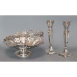 A pair of George V silver candlesticks (a.f.) and a plated cake basket height 22cm