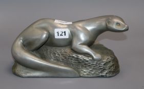 A signed model of an otter width 28cm