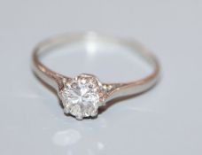 A plat and solitaire diamond ring, (shank split).