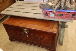 A weathered teak 'X' frame garden table L.152cm