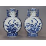 A pair of 19th century Chinese blue and white moon flasks, Kangxi marks, decorated birds and