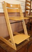 A Stokke Tripp Trapp adjustable chair