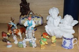 A Copeland Spode model of Cherubs, mixed ceramics and a Chinese carved figure height 21cm