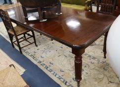 A Victorian mahogany extending dining table 230cm extended (two spare leaves)