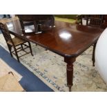 A Victorian mahogany extending dining table 230cm extended (two spare leaves)