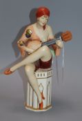 A Royal Dux figure of a lady playing a banjo height 28cm