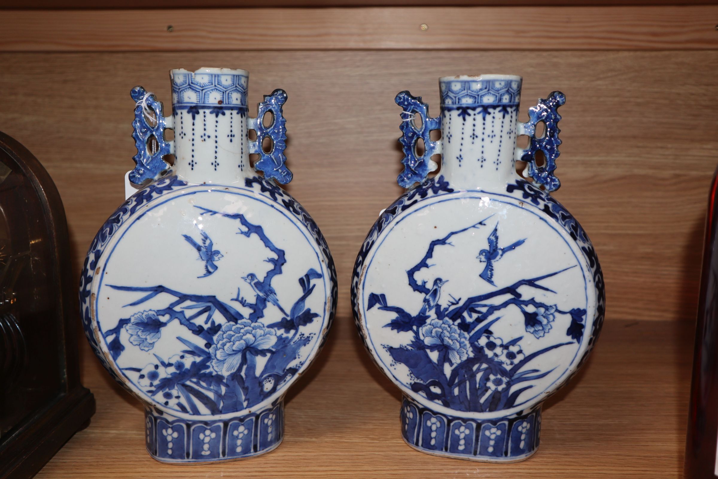 A pair of 19th century Chinese blue and white moon flasks, Kangxi marks, decorated birds and - Image 2 of 11