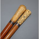 Two malacca canes with pique handles