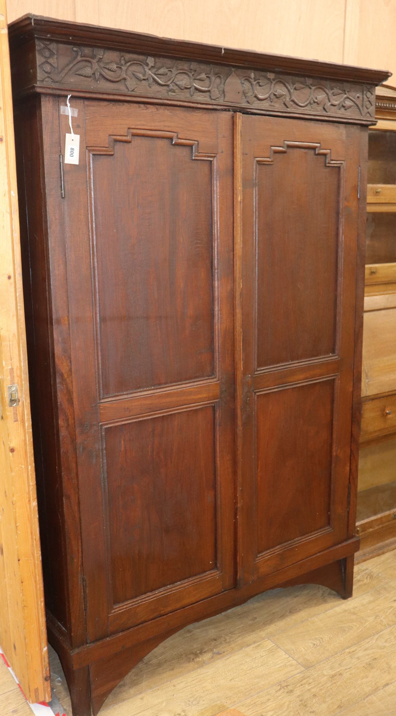 An Indonesian teak two-door cupboard W.124cm