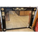 A 19th century Empire style ebonised and gilt metal mounted overmantel mirror with original glass