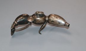 An early 20th century Chinese novelty white metal condiment modelled as a lotus root, 9.5cm.