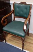 A pair of early Victorian elbow chairs