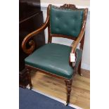 A pair of early Victorian elbow chairs