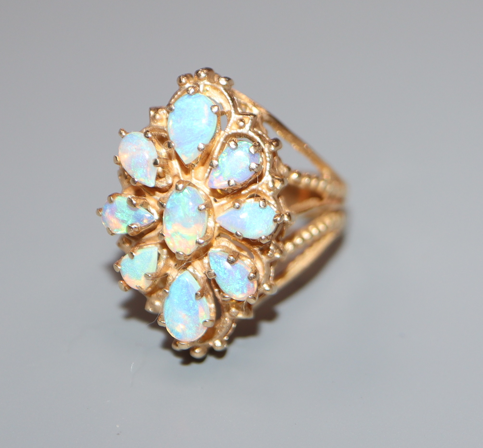 A yellow metal and opal mounted ring, unmarked