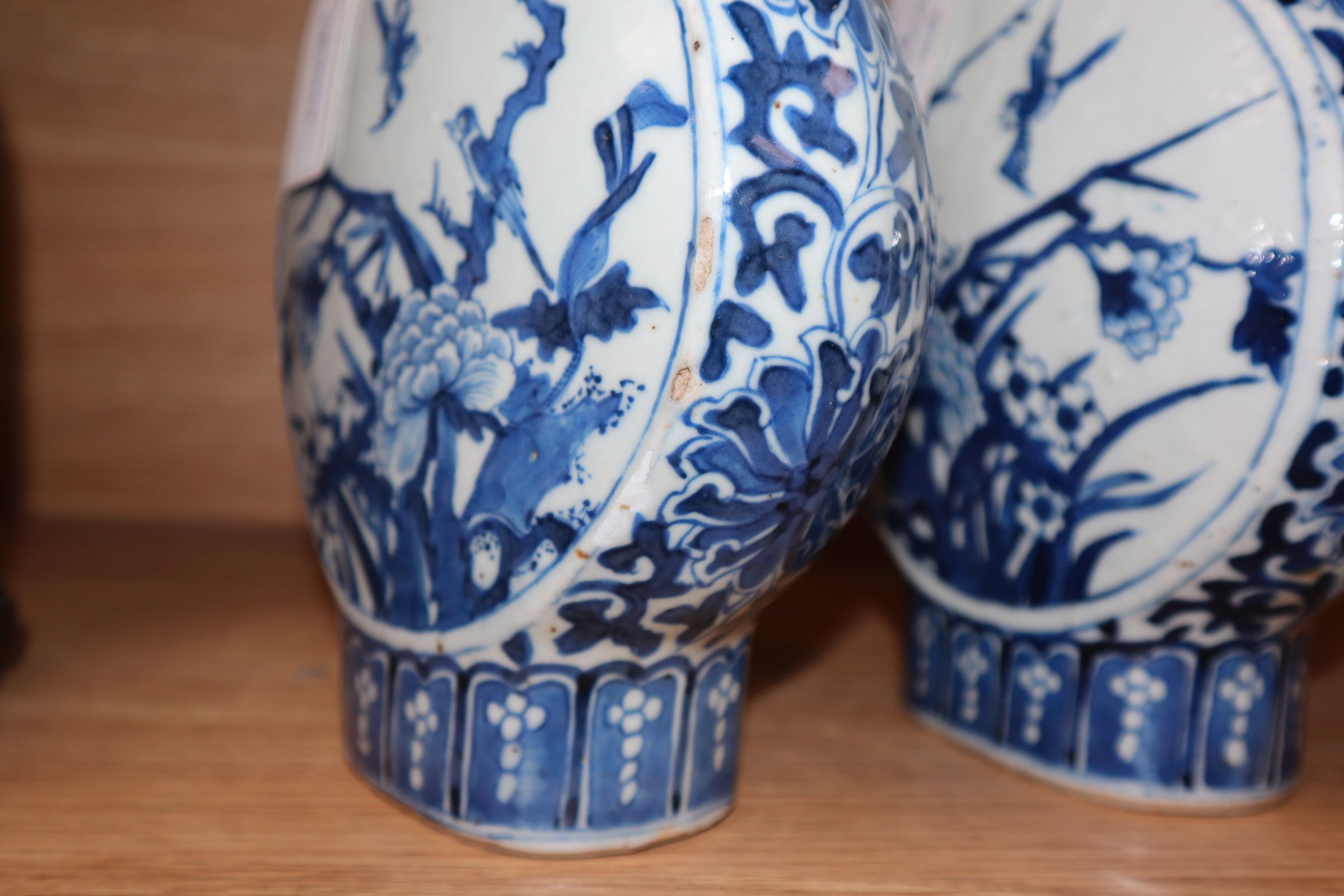 A pair of 19th century Chinese blue and white moon flasks, Kangxi marks, decorated birds and - Image 9 of 11