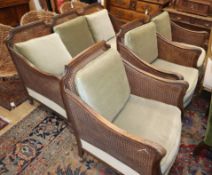 A 1920's carved beech four piece bergere suite