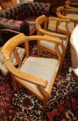 A set of four Arts & Crafts style oak elbow chairs