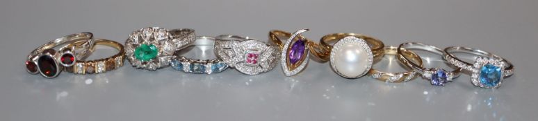 Ten assorted gem set gold dress rings, including seven 9ct gold, two 14k and one 18ct gold.