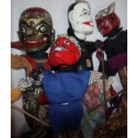 Four Indonesian painted wood puppets